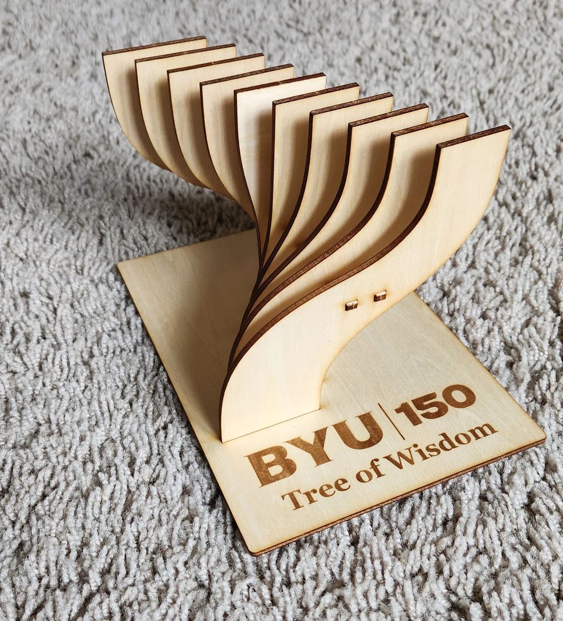 Upright laser-cut wooden Tree of Wisdom miniature on its engraved BYU 150 base