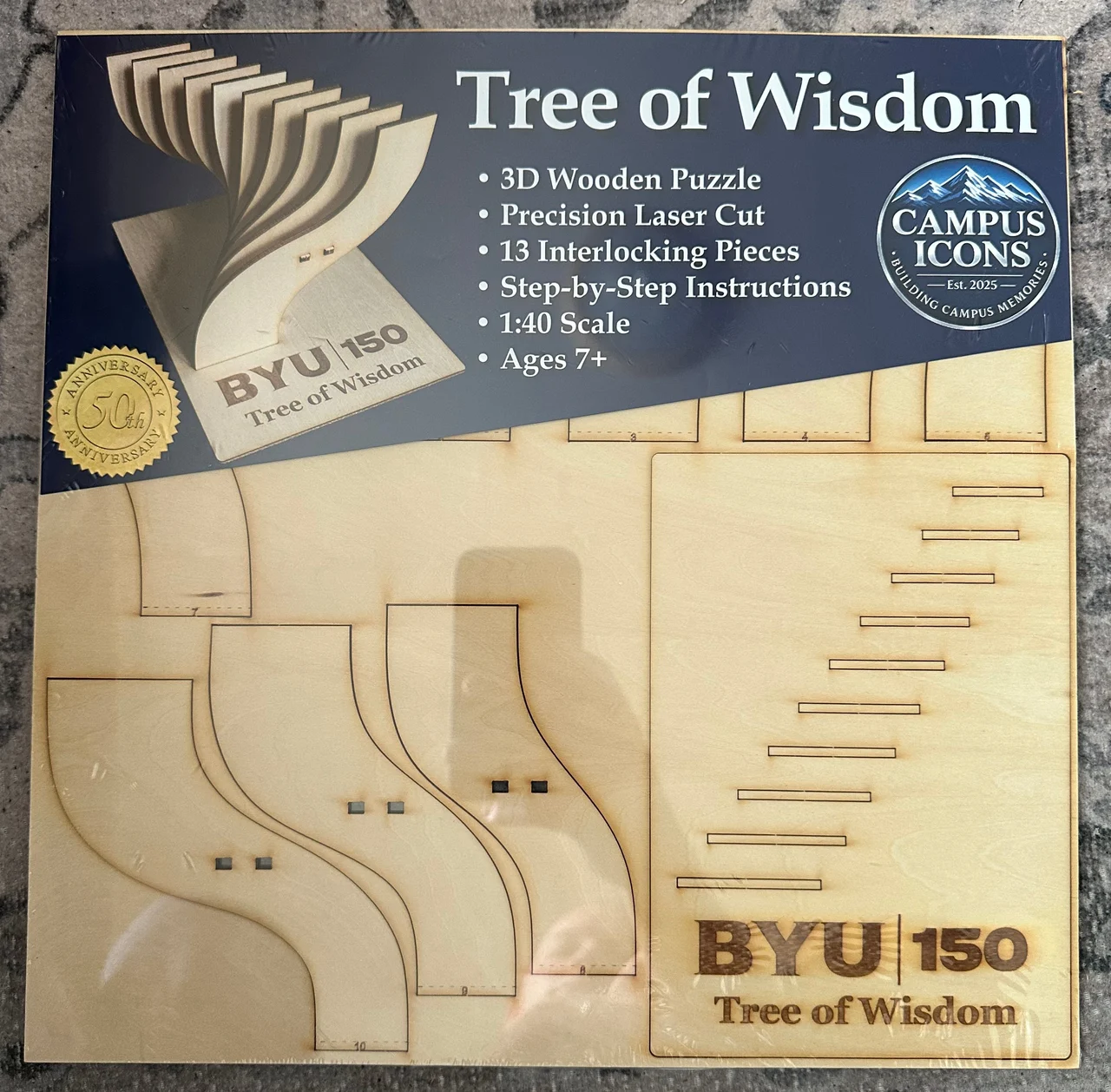 Front of the Tree of Wisdom kit with its blue product header and wooden pieces